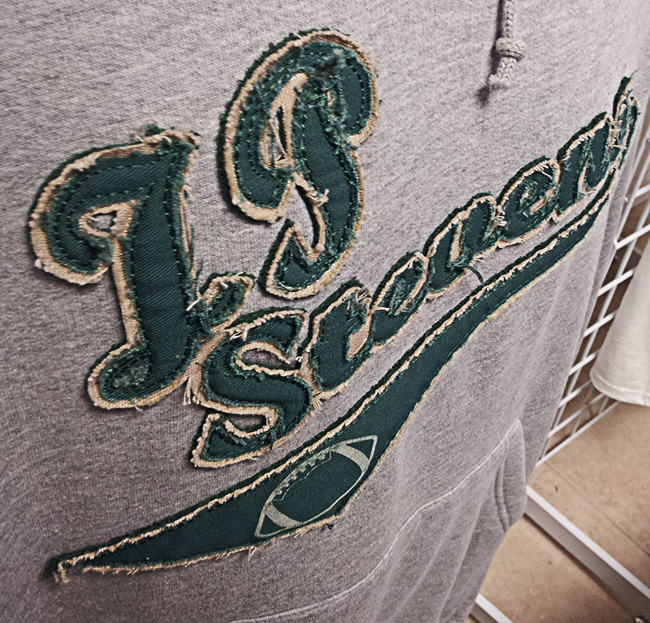 Stylus Apparel offers tackle twill and applique services on custom clothing.